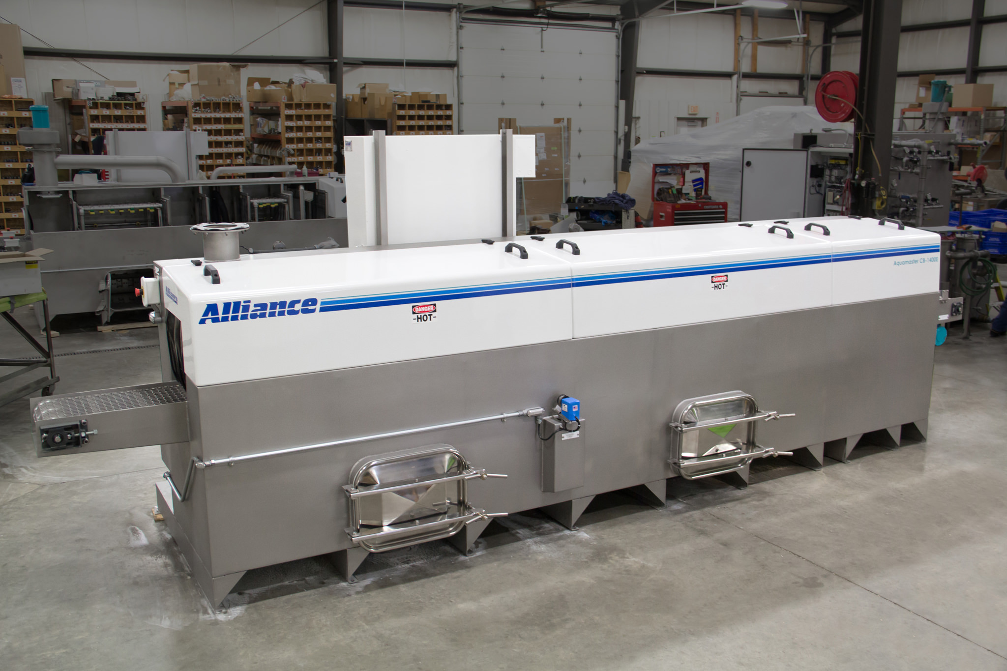 Cleaning various firearm parts on an inline washer