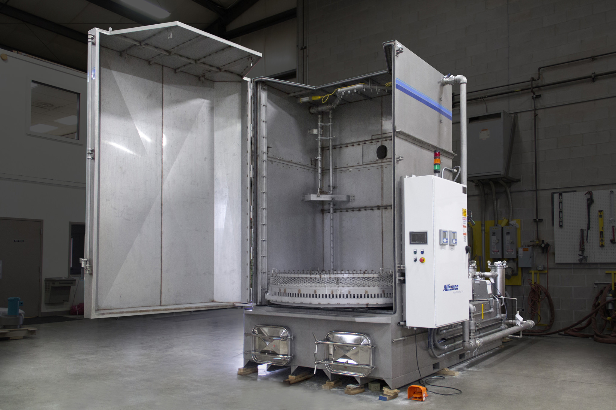 Cabinet washer with wash and rinse stages for missile manufacturer